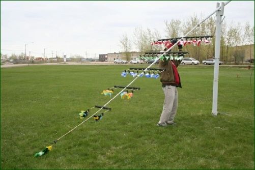 An archer aiming at the fork on the leaning pole