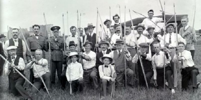 A large group of club members with their bows and poles