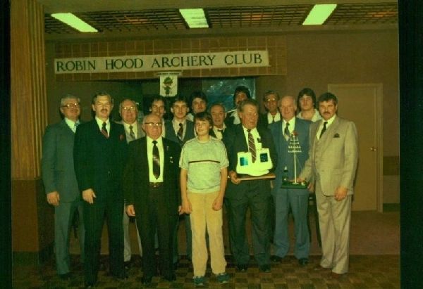 Robin Hood members posing under the club banner in the 1980s