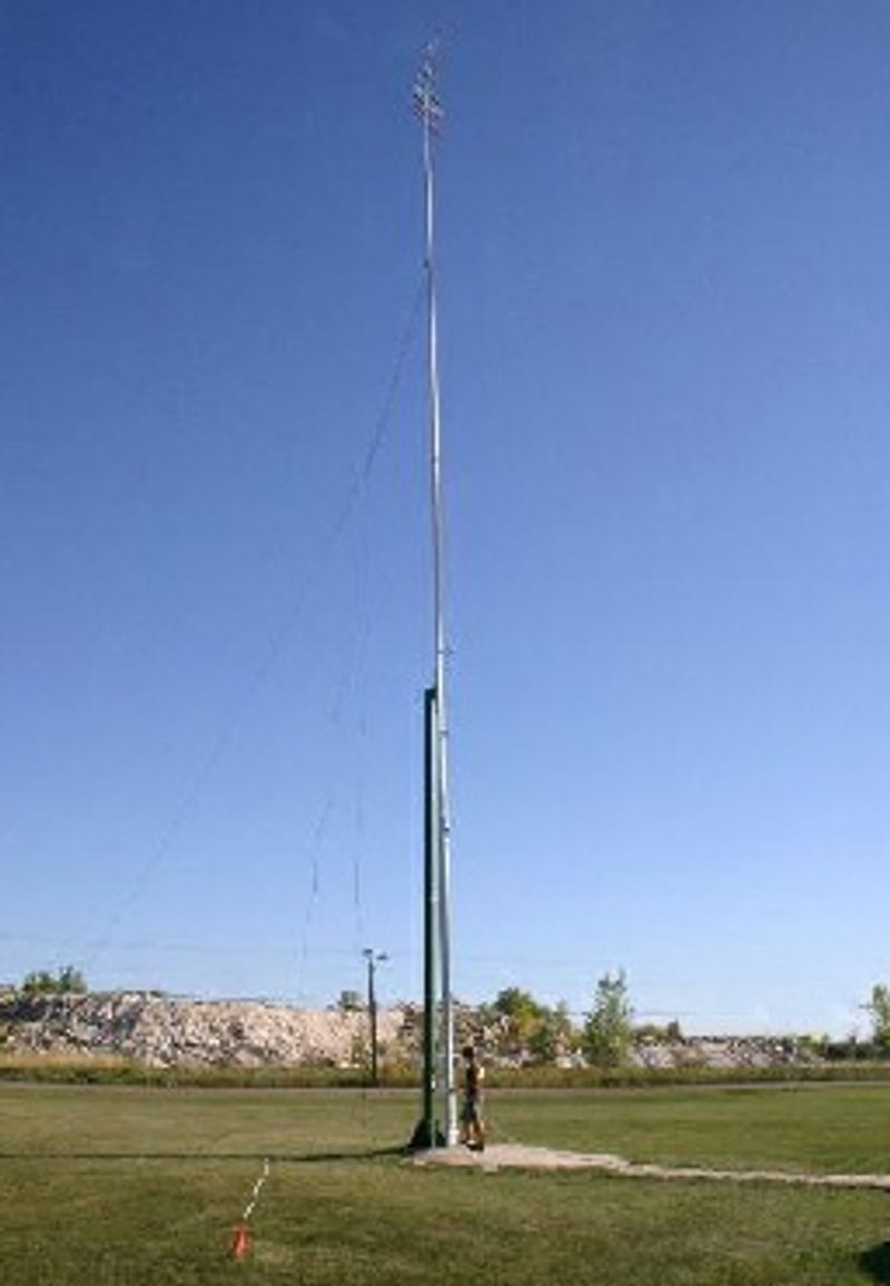 The tall steel pole with the fork at its top, standing in the club's field